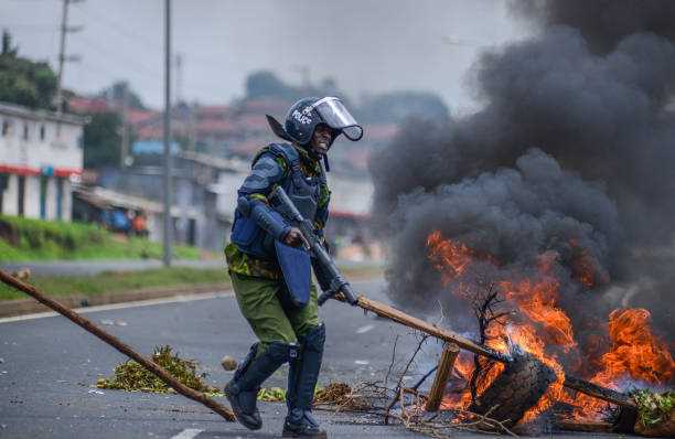 Part of Kenya’s parliament is on fire as thousands of protesters enter. Several bodies are seen