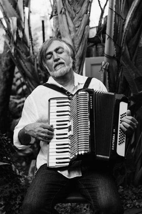 A person playing an accordion
AI-generated content may be incorrect.